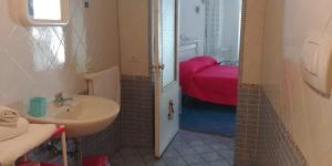 A bed or beds in a room at Da Lucia - Alloggio turistico Santa Maria