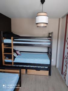 Postel nebo postele na pokoji v ubytování L'Arc en ciel