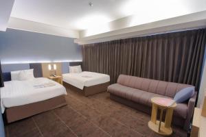 Postel nebo postele na pokoji v ubytování Hearton Hotel Kyoto
