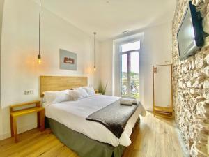Posteľ alebo postele v izbe v ubytovaní Mirandoalaconcha Rooms
