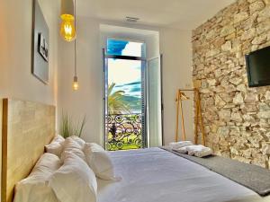 Posteľ alebo postele v izbe v ubytovaní Mirandoalaconcha Rooms