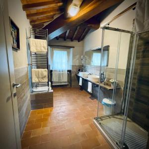 a bathroom with a shower and a sink at La valle B&B in Cavriglia +43 photos