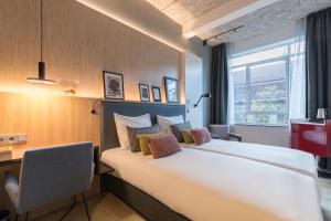 Postel nebo postele na pokoji v ubytování Postillion Hotel WTC Rotterdam + 37 fotografií