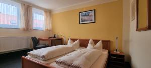 Postel nebo postele na pokoji v ubytování Hotel Seehalde
