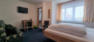 Postel nebo postele na pokoji v ubytování Hotel Seehalde