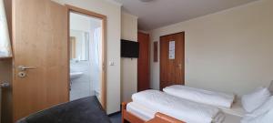 Postel nebo postele na pokoji v ubytování Hotel Seehalde