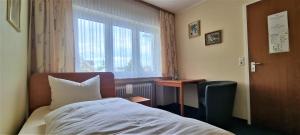 Postel nebo postele na pokoji v ubytování Hotel Seehalde