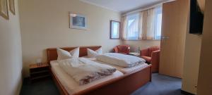 Postel nebo postele na pokoji v ubytování Hotel Seehalde