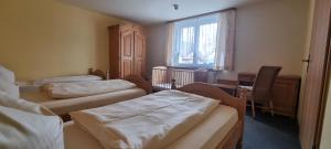 Postel nebo postele na pokoji v ubytování Hotel Seehalde