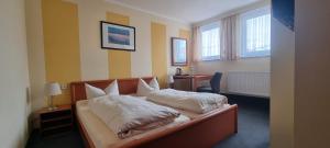 Postel nebo postele na pokoji v ubytování Hotel Seehalde
