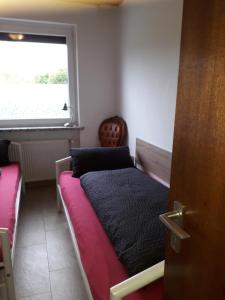 Postel nebo postele na pokoji v ubytování Heidehaus Hodenhagen