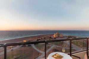 a view of the ocean from the balcony of a hotel at Cactus Hotel in Rhodes Town