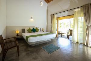 Letto o letti in una camera di KayJay Palms