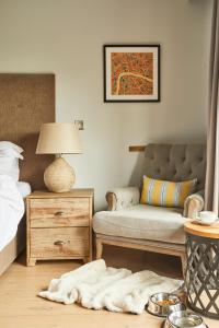 A bed or beds in a room at The Swan at Streatley 