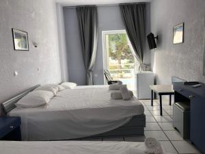 Postel nebo postele na pokoji v ubytování Mistral-Καπος