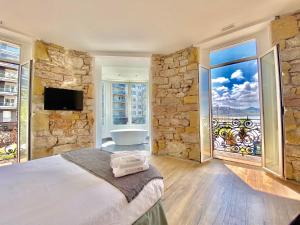 Posteľ alebo postele v izbe v ubytovaní Mirandoalaconcha Rooms