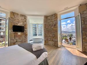 Posteľ alebo postele v izbe v ubytovaní Mirandoalaconcha Rooms