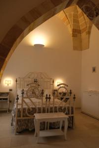 Postel nebo postele na pokoji v ubytování PLAZACARRISI HOTEL & SPA