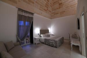 Postel nebo postele na pokoji v ubytování PLAZACARRISI HOTEL & SPA