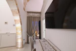 TV a/nebo společenská místnost v ubytování PLAZACARRISI HOTEL & SPA
