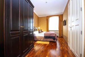Postel nebo postele na pokoji v ubytování SKARITZ Hotel & Residence