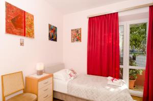 Postel nebo postele na pokoji v ubytování Apartment Red Orange