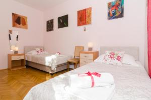 Postel nebo postele na pokoji v ubytování Apartment Red Orange + 7 fotografií