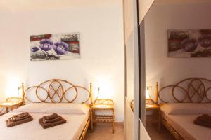 Postel nebo postele na pokoji v ubytování Casa Vacanza Chiasardinia