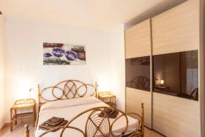 מיטה או מיטות בחדר ב-Casa Vacanza Chiasardinia