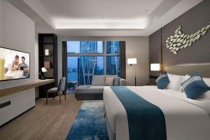 Postelja oz. postelje v sobi nastanitve Ascott Xiangjiang FFC Changsha