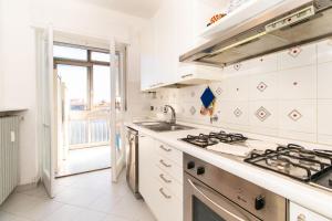 Kuchyň nebo kuchyňský kout v ubytování Olimpico & Pala Alpitour Terrace Apartment