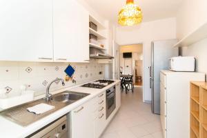 Kuchyň nebo kuchyňský kout v ubytování Olimpico & Pala Alpitour Terrace Apartment