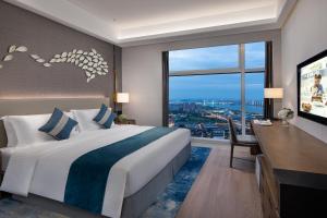Postelja oz. postelje v sobi nastanitve Ascott Xiangjiang FFC Changsha
