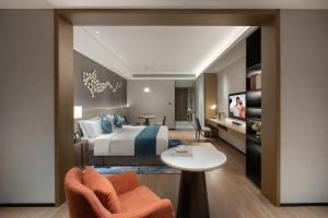 Postelja oz. postelje v sobi nastanitve Ascott Xiangjiang FFC Changsha