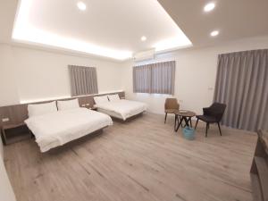 Ένα ή περισσότερα κρεβάτια σε δωμάτιο στο Blue Sea Stone Homestay
