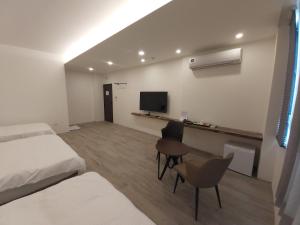 Μια τηλεόραση ή/και κέντρο ψυχαγωγίας στο Blue Sea Stone Homestay