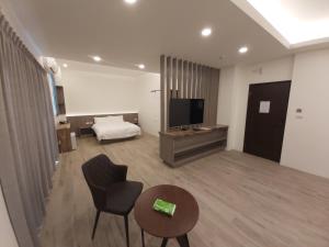 TV a/nebo společenská místnost v ubytování Blue Sea Stone Homestay