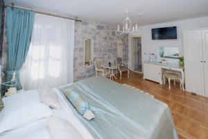 Postel nebo postele na pokoji v ubytování Deluxe Collection Hotel Kastel