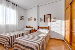 Lova arba lovos apgyvendinimo įstaigoje Apartment Ramon Gallud 204