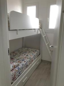 A bed or beds in a room at La dolce vita , fronte mare