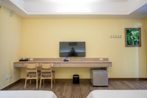 Televisor o centre d'entreteniment de MuXia Fengqing Homestay