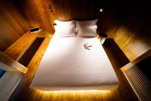 Postel nebo postele na pokoji v ubytování Zero Box Lodge Coimbra