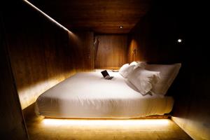 Postel nebo postele na pokoji v ubytování Zero Box Lodge Coimbra