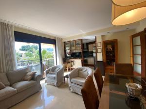 Posezení v ubytování LLOGUER30 Los delfines, swimming pools , near the beach and with parking
