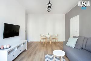 TV a/nebo společenská místnost v ubytování MS Apartments Kopernicus II