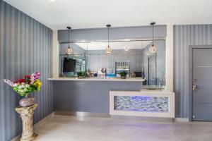 a kitchen with a counter and a sink in a room at Studio 6 Deer Park, Tx in Deer Park