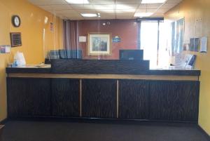 The lobby or reception area at Days Inn by Wyndham Henrietta/Rochester Area