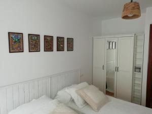 Katil atau katil-katil dalam bilik di Apartamento Conlledo