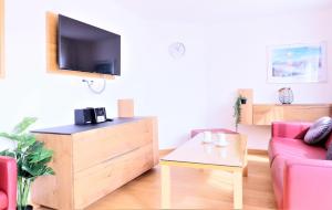 Telewizja i/lub zestaw kina domowego w obiekcie Chalet Schmittenbach - Pinzgau Holidays
