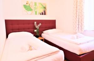 Łóżko lub łóżka w pokoju w obiekcie Chalet Schmittenbach - Pinzgau Holidays